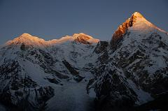 
The first rays of sunrise silhouette Pungpa Ri, the Shishapangma East Face and Phola Gangchen from Kong Tso camp (5198m).
